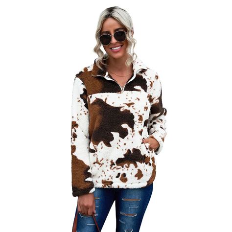 Get cozy and chic with our Cow Print Fleece Pullover